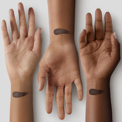 Black Radiance applying stick to cheek showing seamless blending benefit