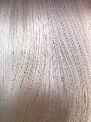 Bleach London shampoo applied to blonde hair in salon setting showing neutralized brass and shine