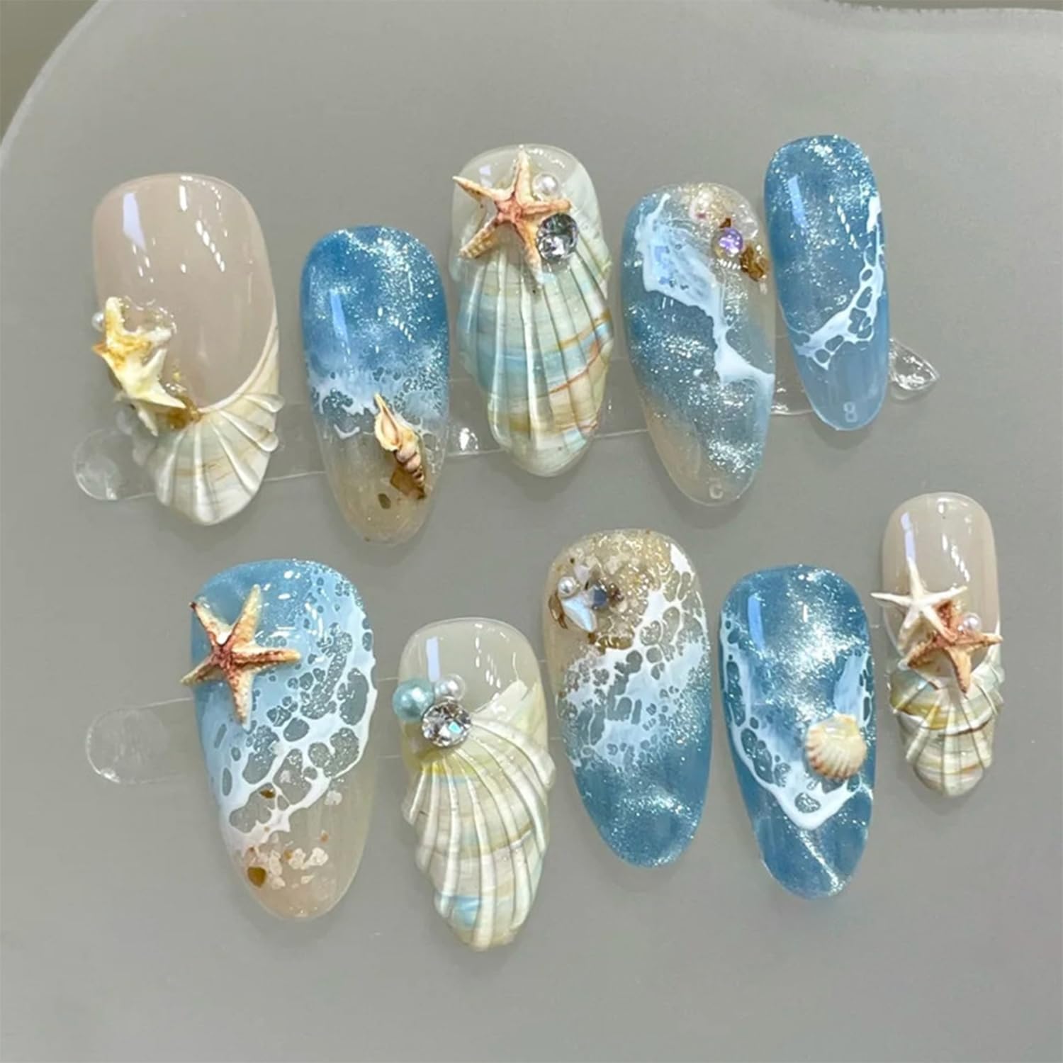 Bloazife front packaging showing 30 beach-themed press-on nails and tools for easy use