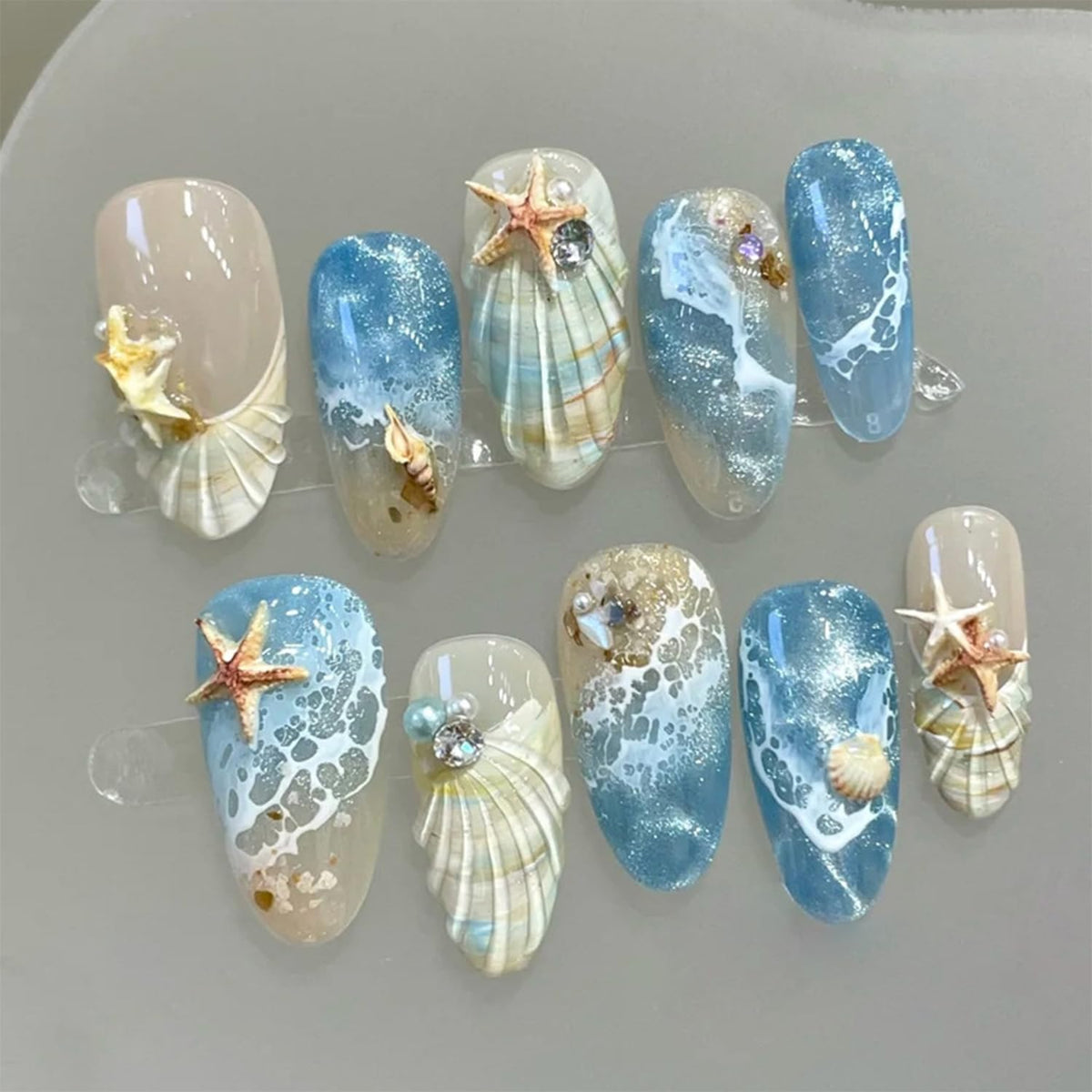 Bloazife front packaging showing 30 beach-themed press-on nails and tools for easy use