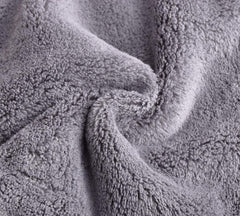 BloomSesame cloth in hand showing 5 by 5 inch size for precise facial use