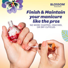 Drop of Blossom oil on skin showing lightweight texture that hydrates cuticles