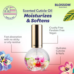 Blossom Cherry cuticle oil on a hand in natural setting showing softer-looking nails