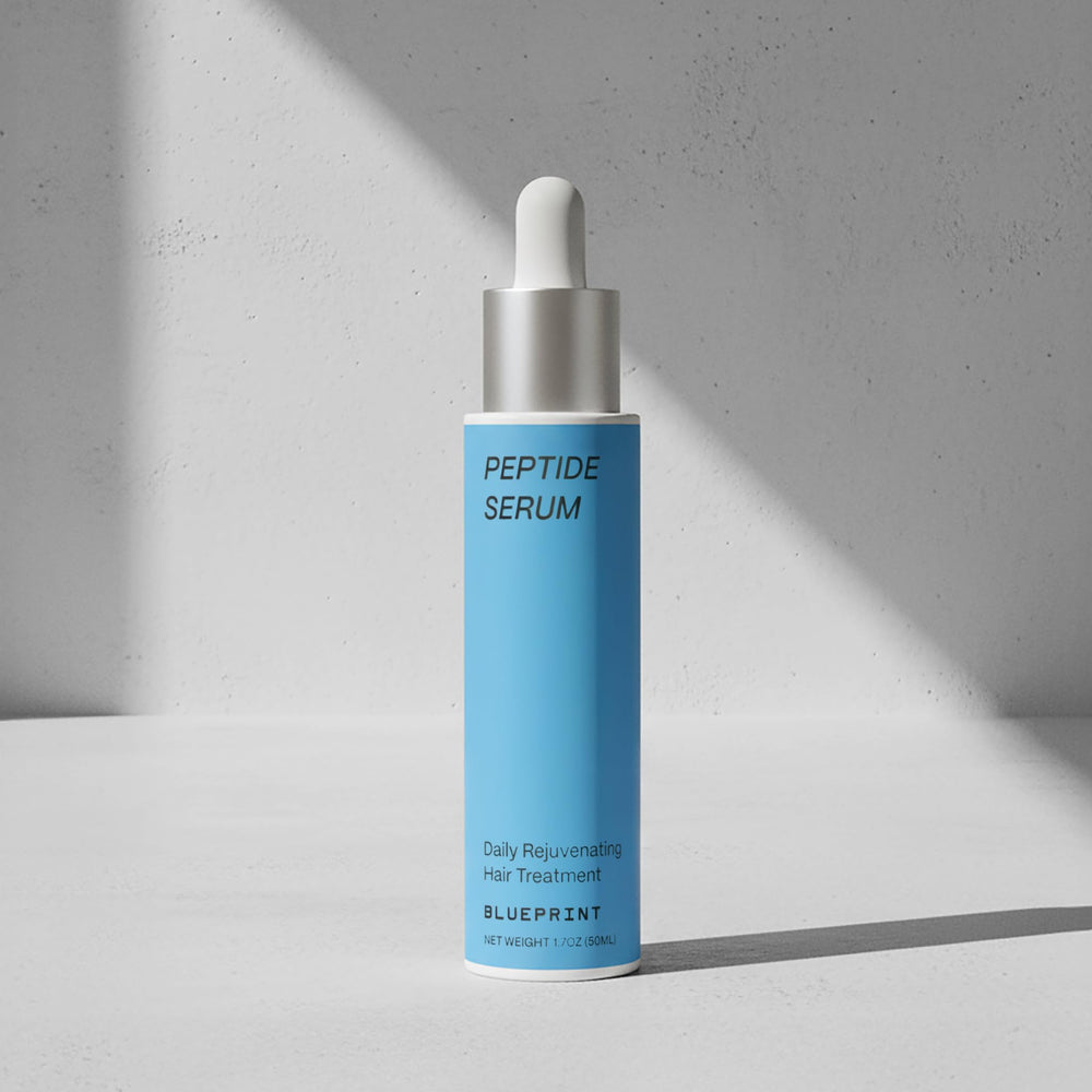 Blueprint Bryan Johnson precision dropper applying serum directly to scalp for targeted delivery