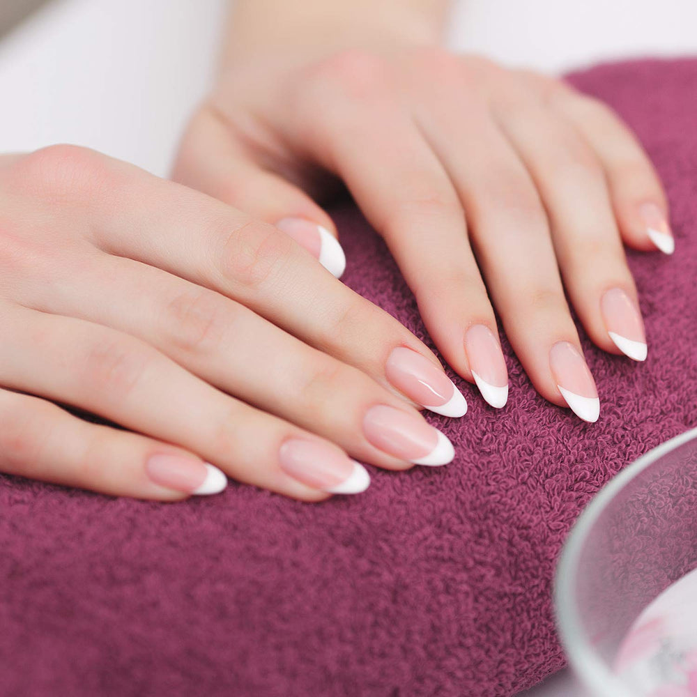Blulu pencil in use drawing a precise white French tip for neat manicure results