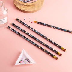 Blulu pencil placing rhinestone on nail for cleaner, faster work