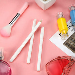 Blulu pencils beside a hand to show compact scale and travel-friendly convenience
