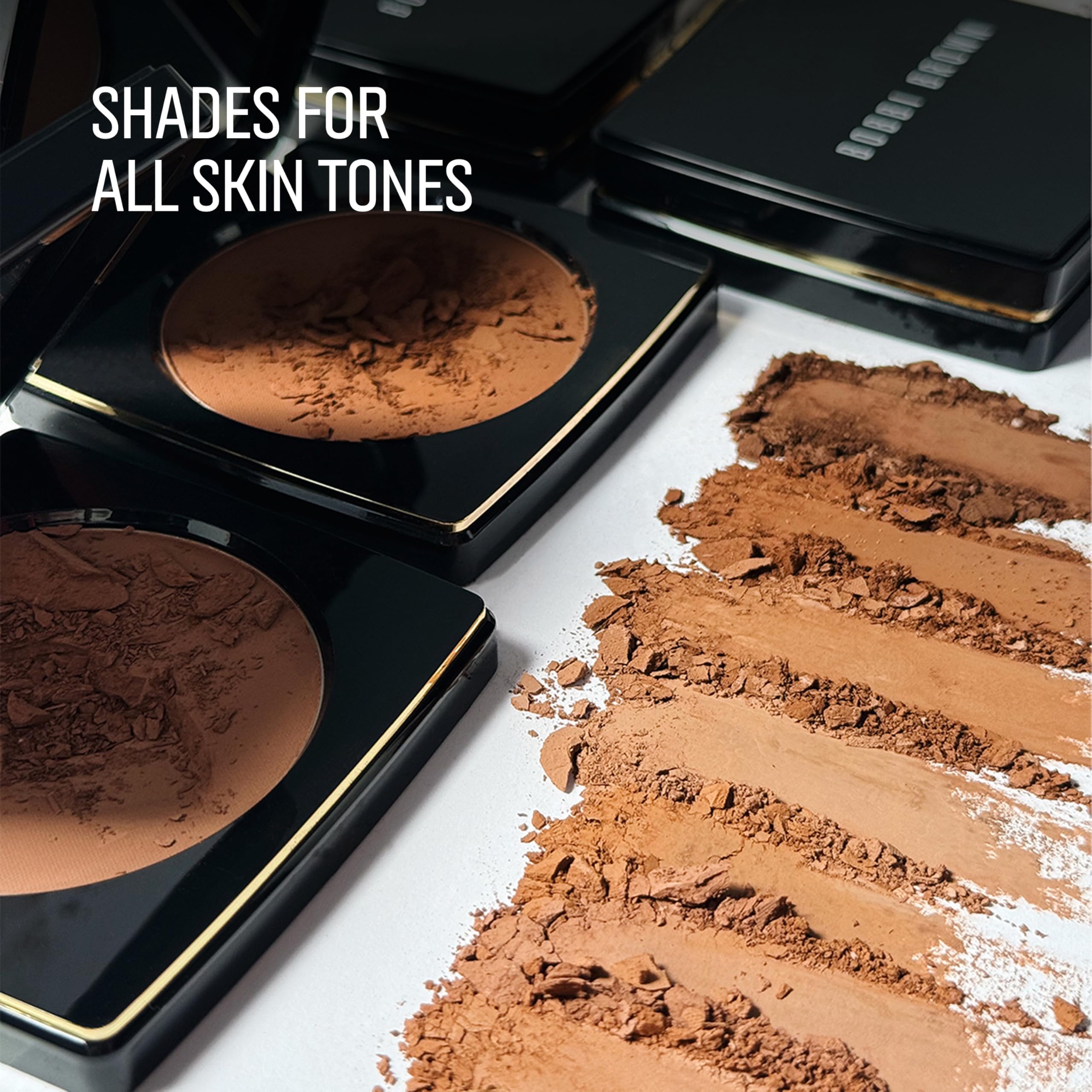 Hand holding Bobbi Brown bronzing powder compact to show actual size and travel-friendly benefit