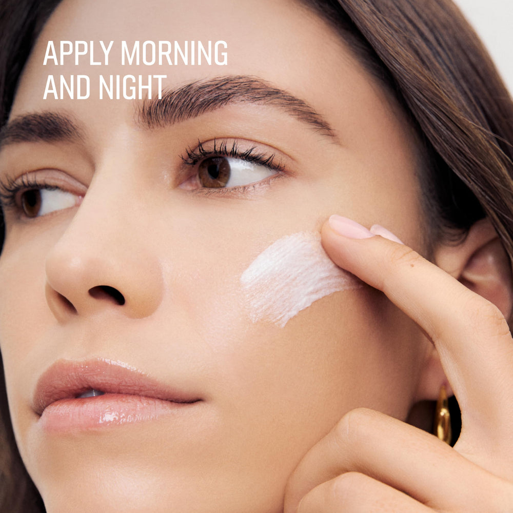 Bobbi Brown cream on fingers demonstrating lightweight spreadability and absorption