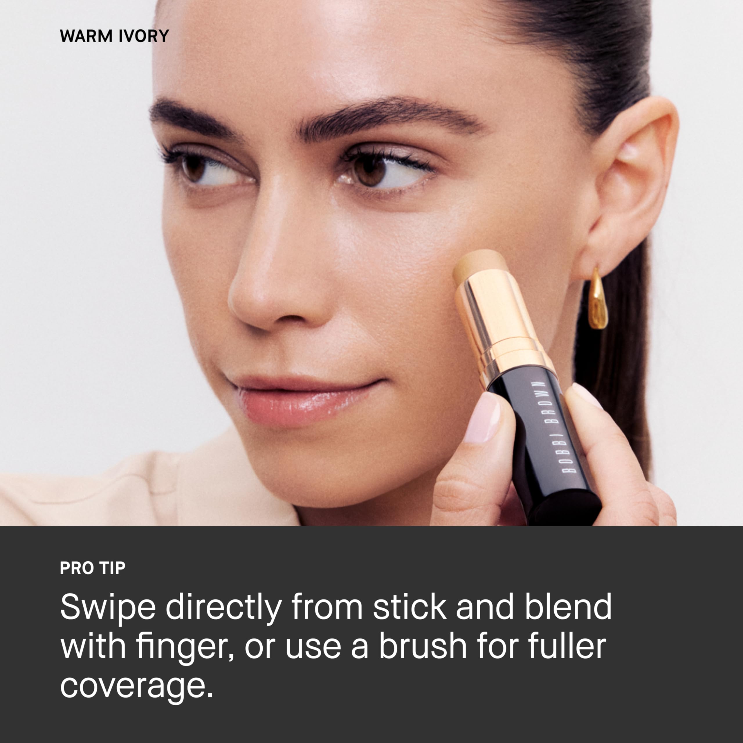 Bobbi Brown using stick to clean up winged eyeliner for precise finish