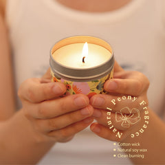 BODY & EARTH # LOVE scented candle lit in a cozy setting promoting relaxation