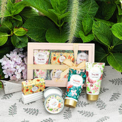 BODY & EARTH # LOVE hand holding products for scale illustrating travel-friendly sizes