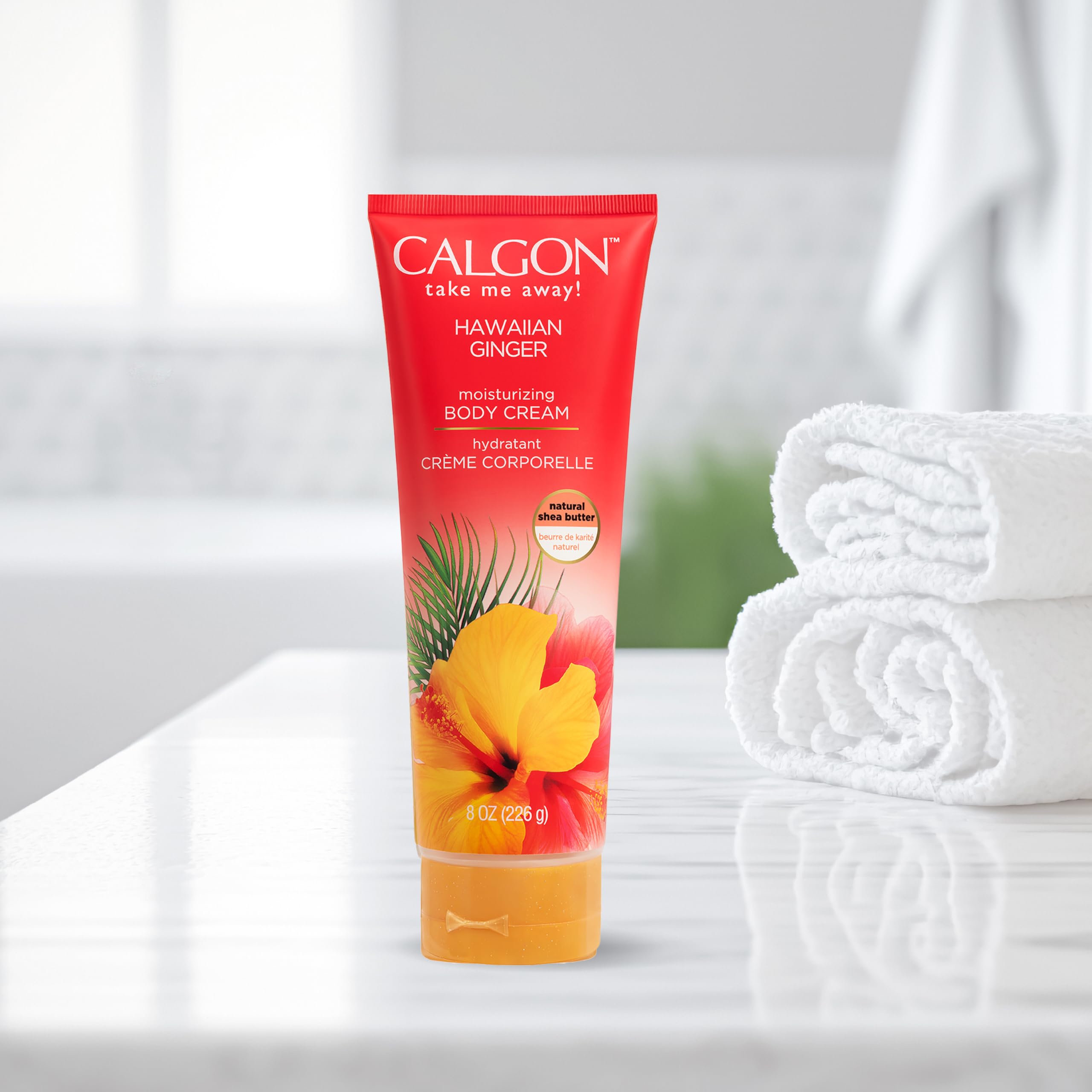 Body Fantasies jar inside beach bag suggesting vacation-ready tropical fragrance benefit