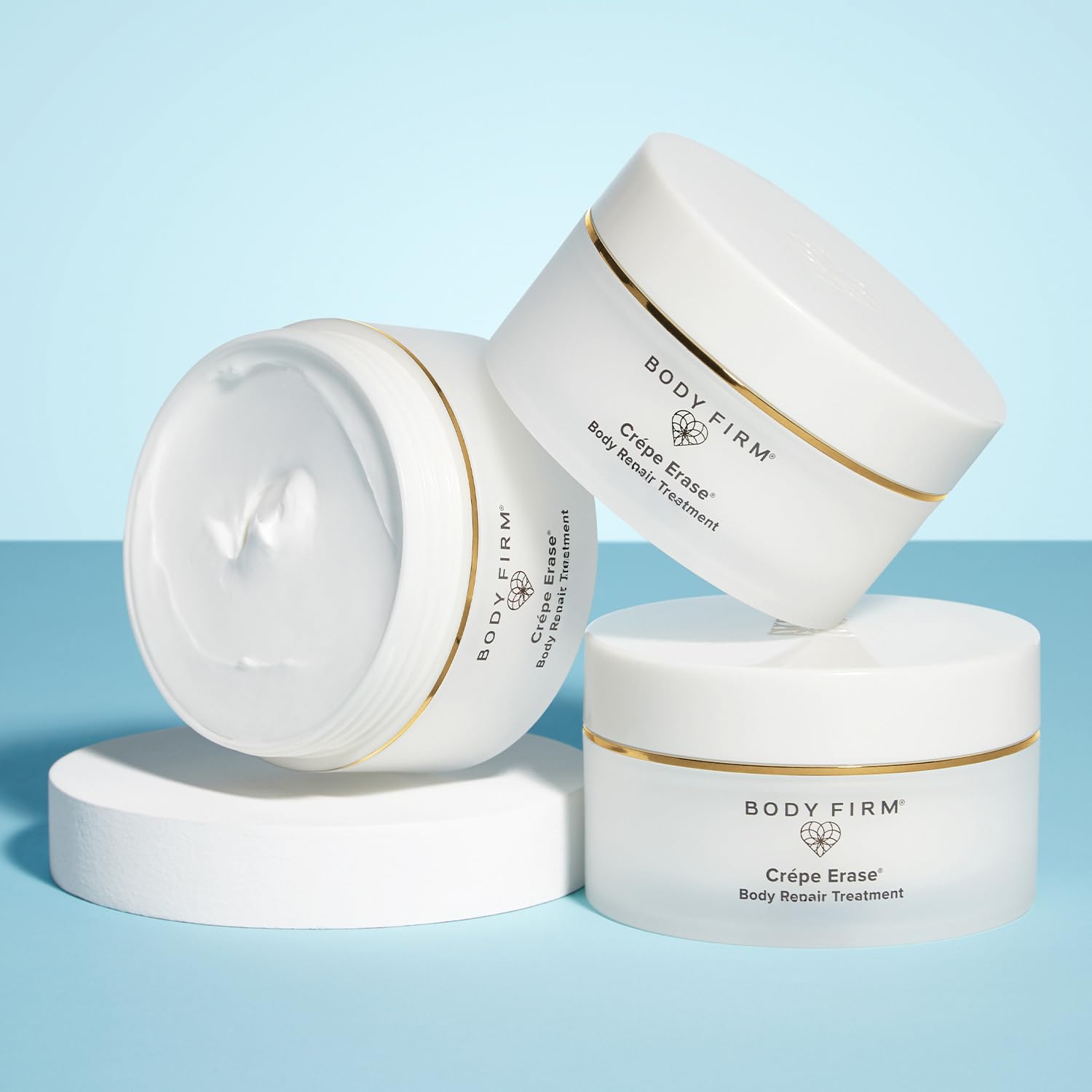 BODY FIRM ingredients flatlay with oils and shea butter highlighting nourishing benefit