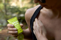 BodyGlide Skin Glide tucked into travel bag pocket, portable protection on the go