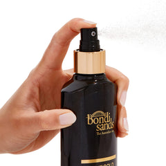 Bondi Sands oil texture on hand showing smooth, hydrating finish benefit