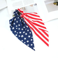 Bookay scrunchies on flag background emphasizing festive holiday style