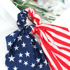 Bookay scrunchie worn in ponytail adding patriotic color and secure hold