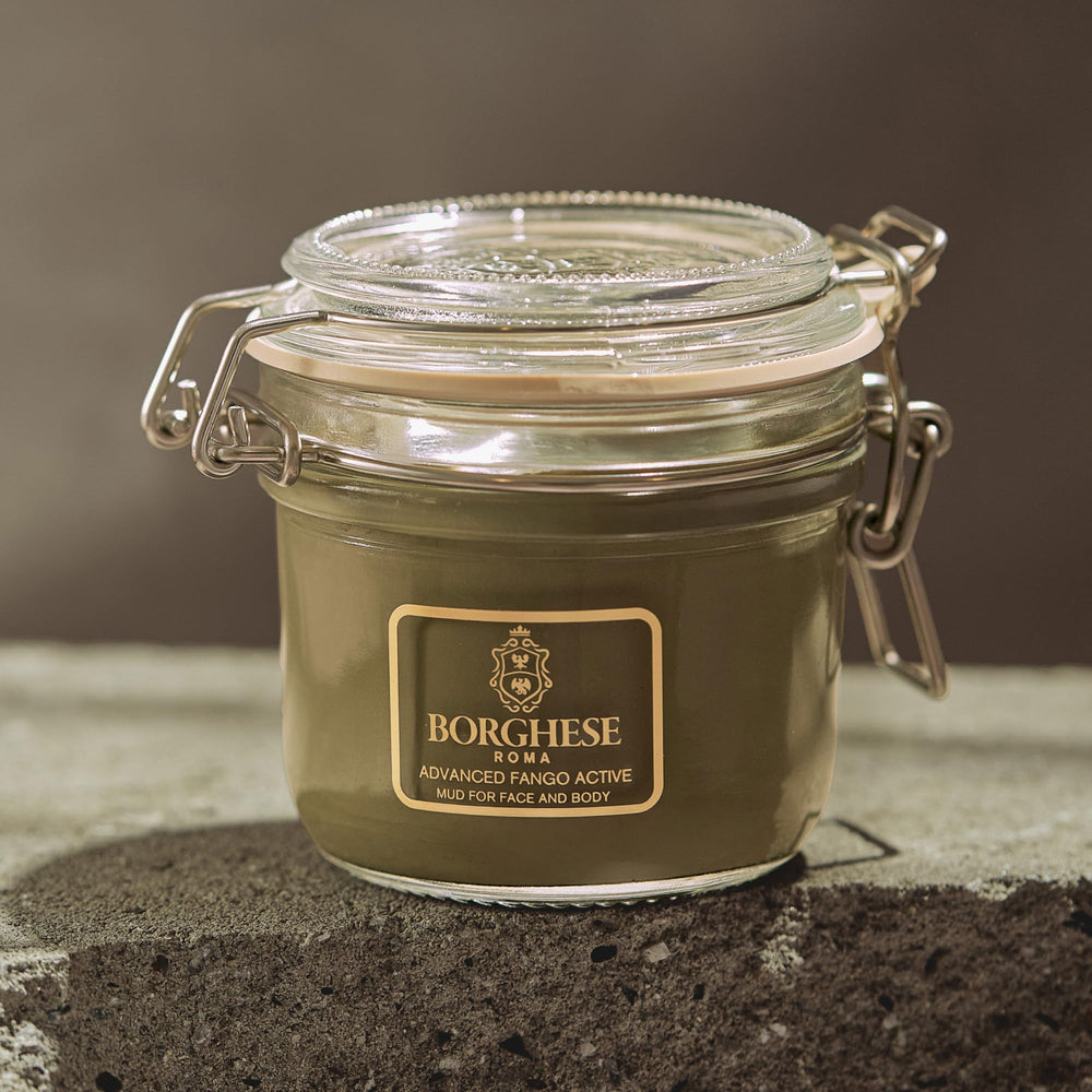 Hand holding Borghese 7.5 oz jar to show size and portability