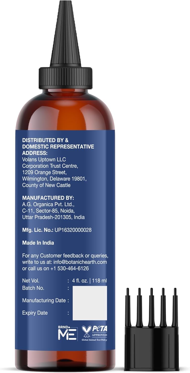 Botanic Hearth applying oil to scalp for targeted nourishment