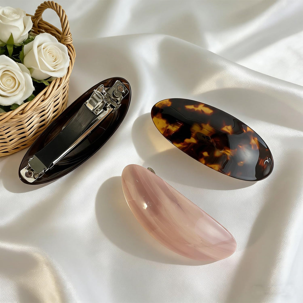 BOUNIQ barrette held in hand to show scale and comfortable size