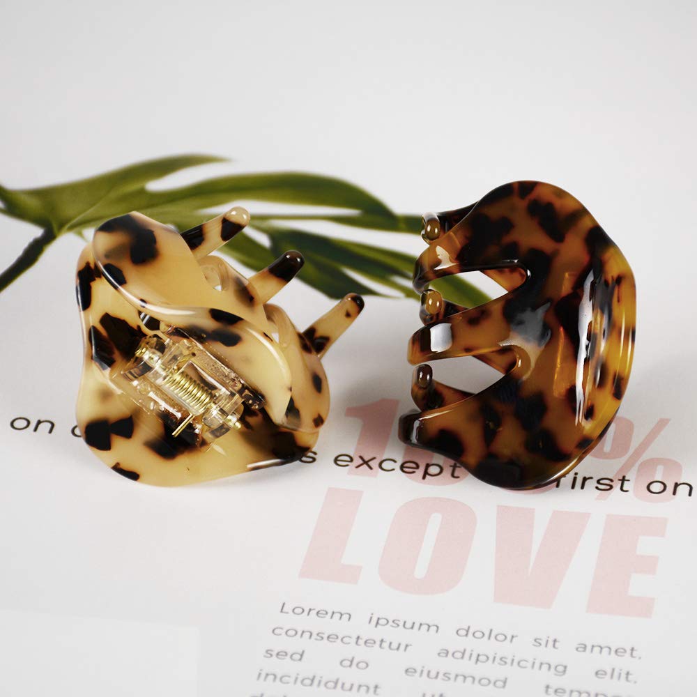 BOUNIQ tortoise clips on a desk by a notebook for fashionable on-the-go use