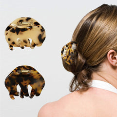 BOUNIQ used in a compact bun showing neat styling and medium hold