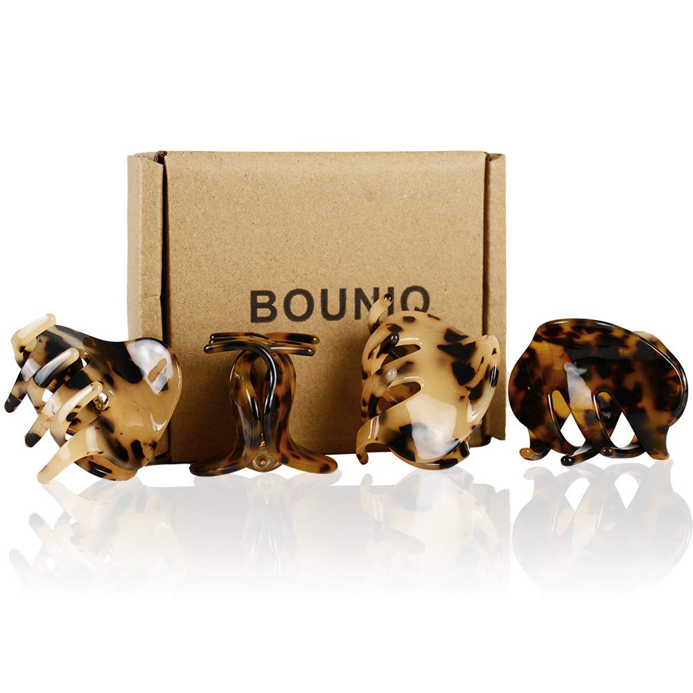 BOUNIQ next to a coin to show 2.1-inch size for scale and portability