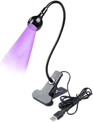 Bovmics lamp front view with clip showing compact portability and stable base