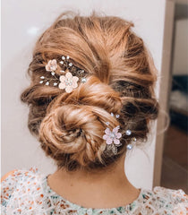 BOYIVI comb placed in bridal updo demonstrating secure, decorative finish