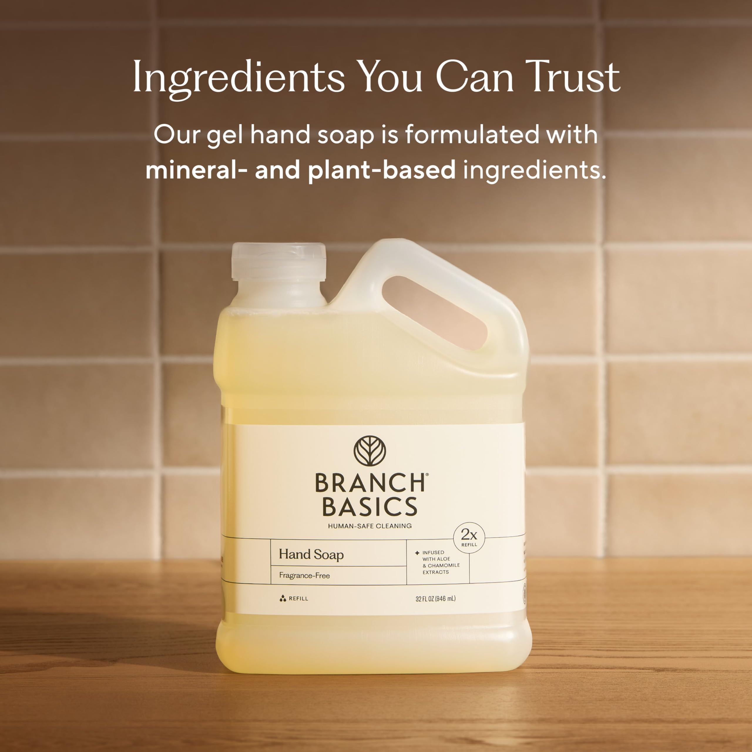 Branch Basics refill being poured into a glass soap bottle for convenient use
