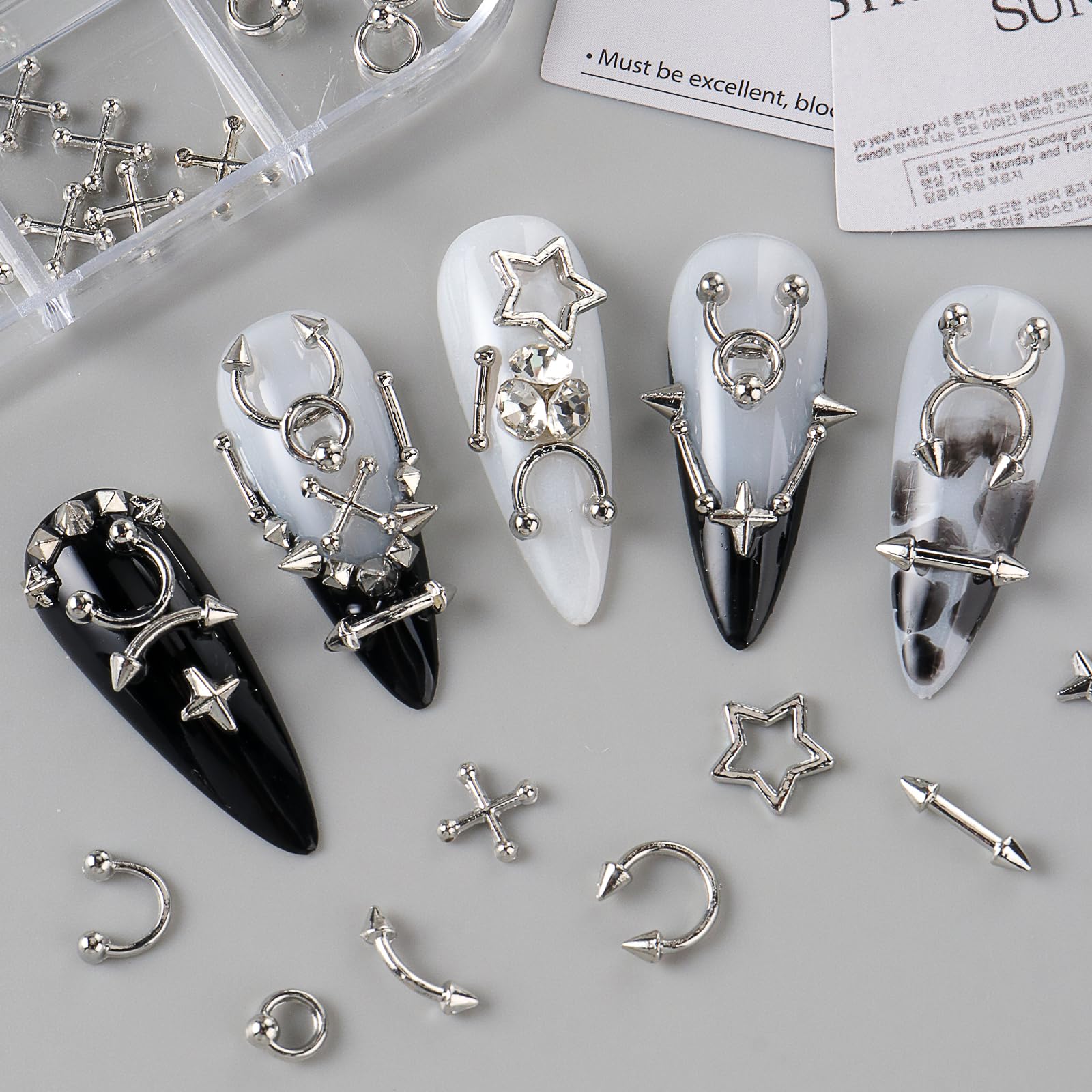 Bravizvy stars and rivets applied on a nail creating bold punk accents