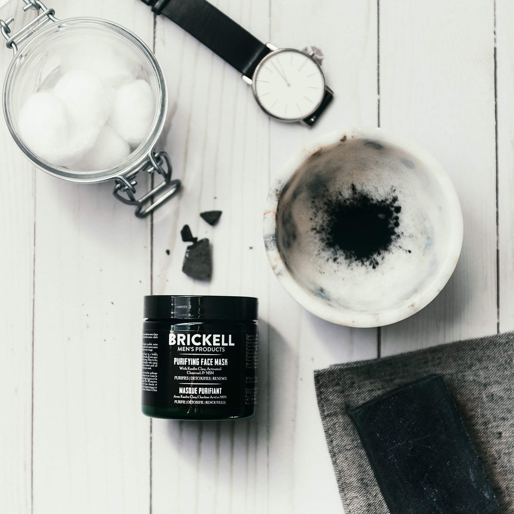 Brickell applying mask with hand demonstrating easy spreadability and control