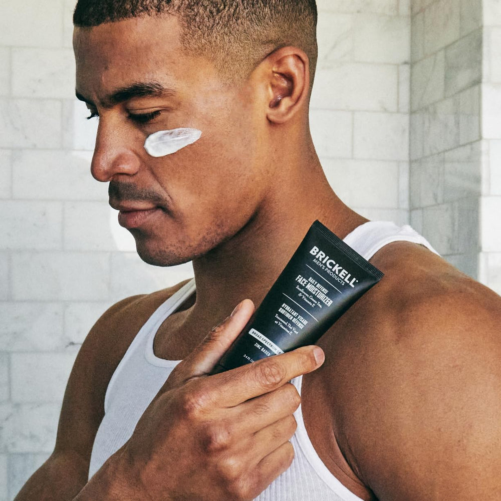 Brickell Men’s Products tube next to ruler for clear 3.4oz size and travel convenience