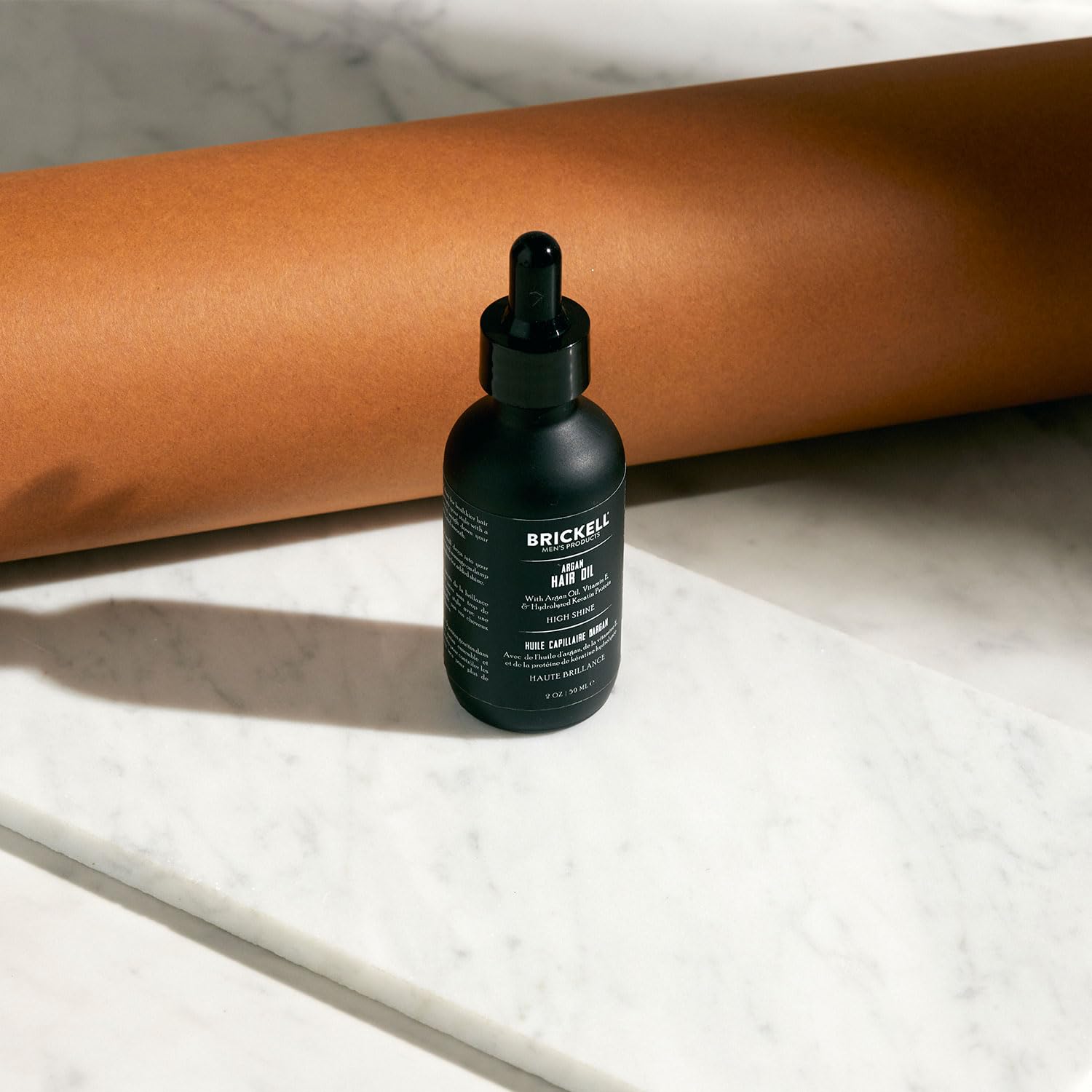 Brickell Men's Product on damp hair before and after showing reduced frizz