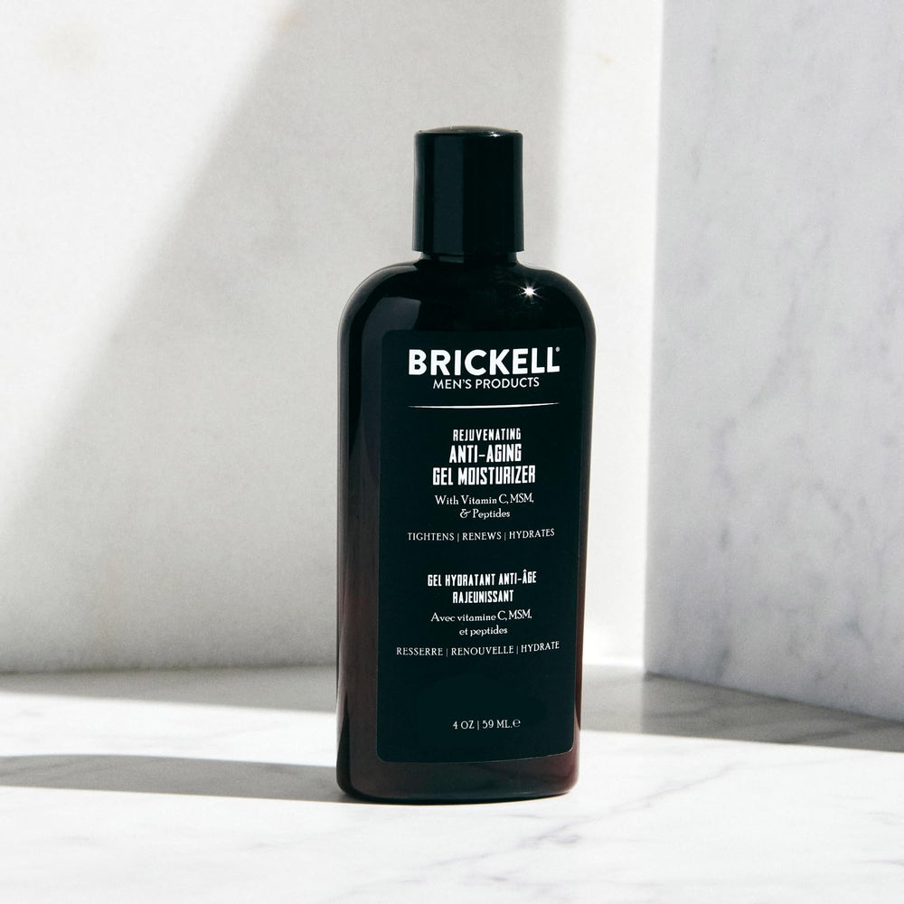 Brickell men's gel moisturizer held in hand to show 4oz scale and easy daily-usage benefit