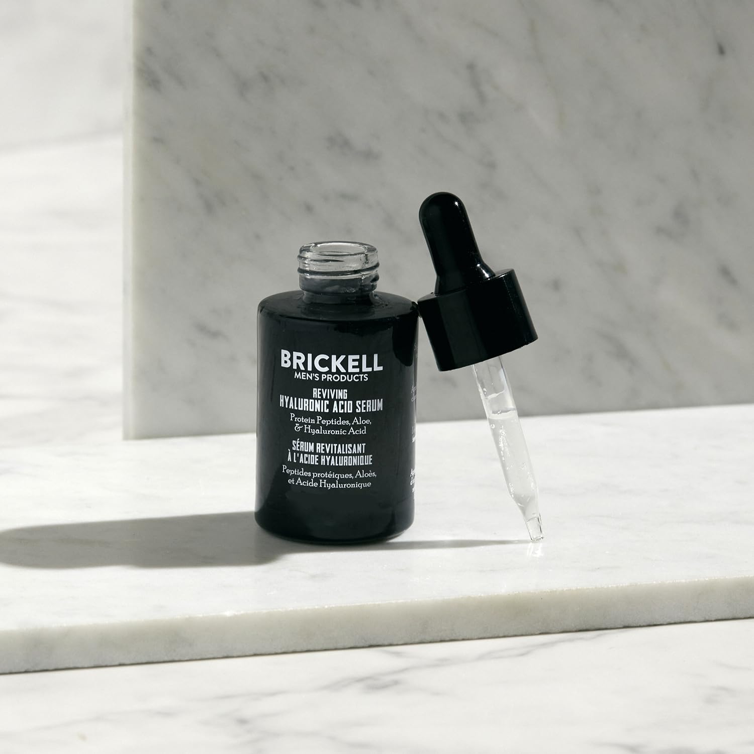 Brickell close-up of pump dispensing serum, highlighting precise application and minimal waste