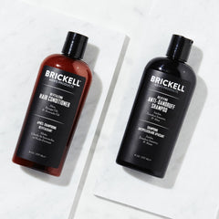 Brickell shampoo pump close-up showing foamy texture for effective cleansing