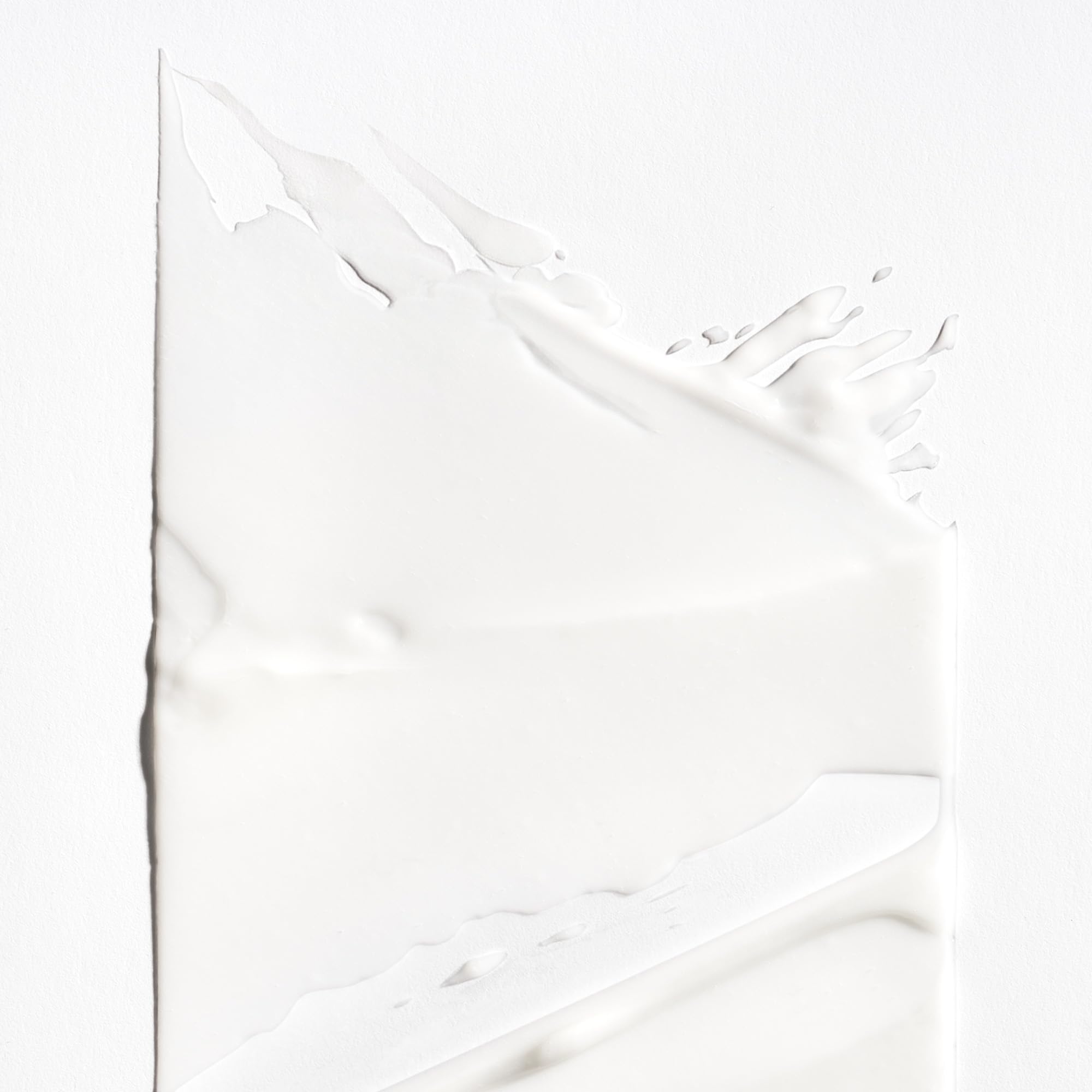 Briogeo conditioner texture close-up displaying slip and moisturizing feel