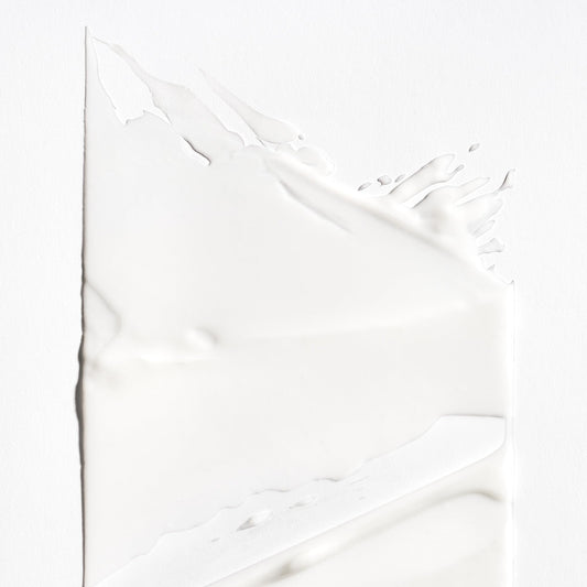 Briogeo conditioner texture close-up displaying slip and moisturizing feel
