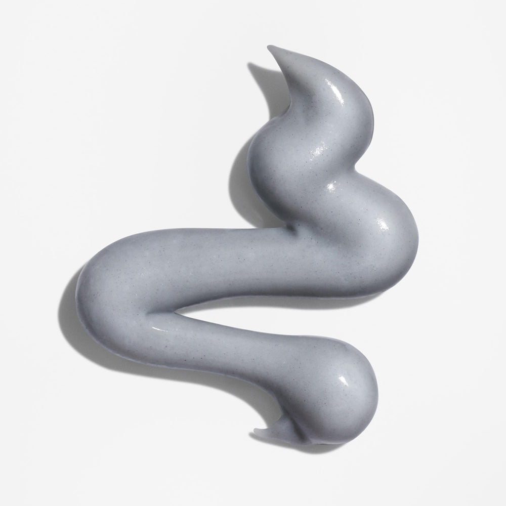 Briogeo open tub revealing mask texture and creamy charcoal appearance