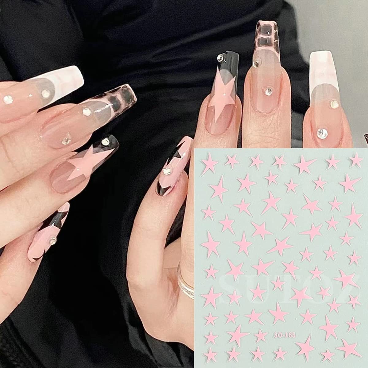 BSBTBZ finished manicure with star decals providing polished decorative accent