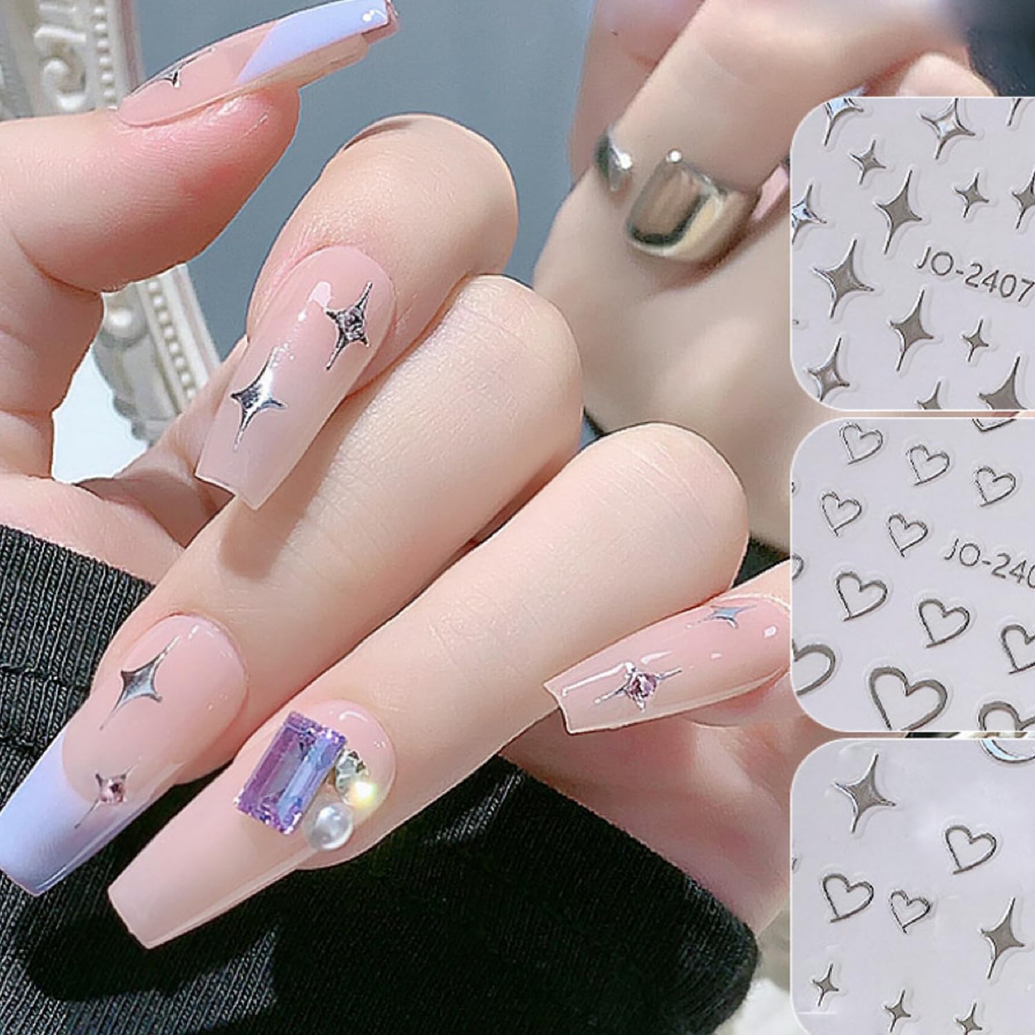 BSBTBZ sticker being applied with tweezers showing precise placement for neat nails