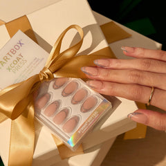 BTArtbox nails held on fingers to show short almond scale and fit