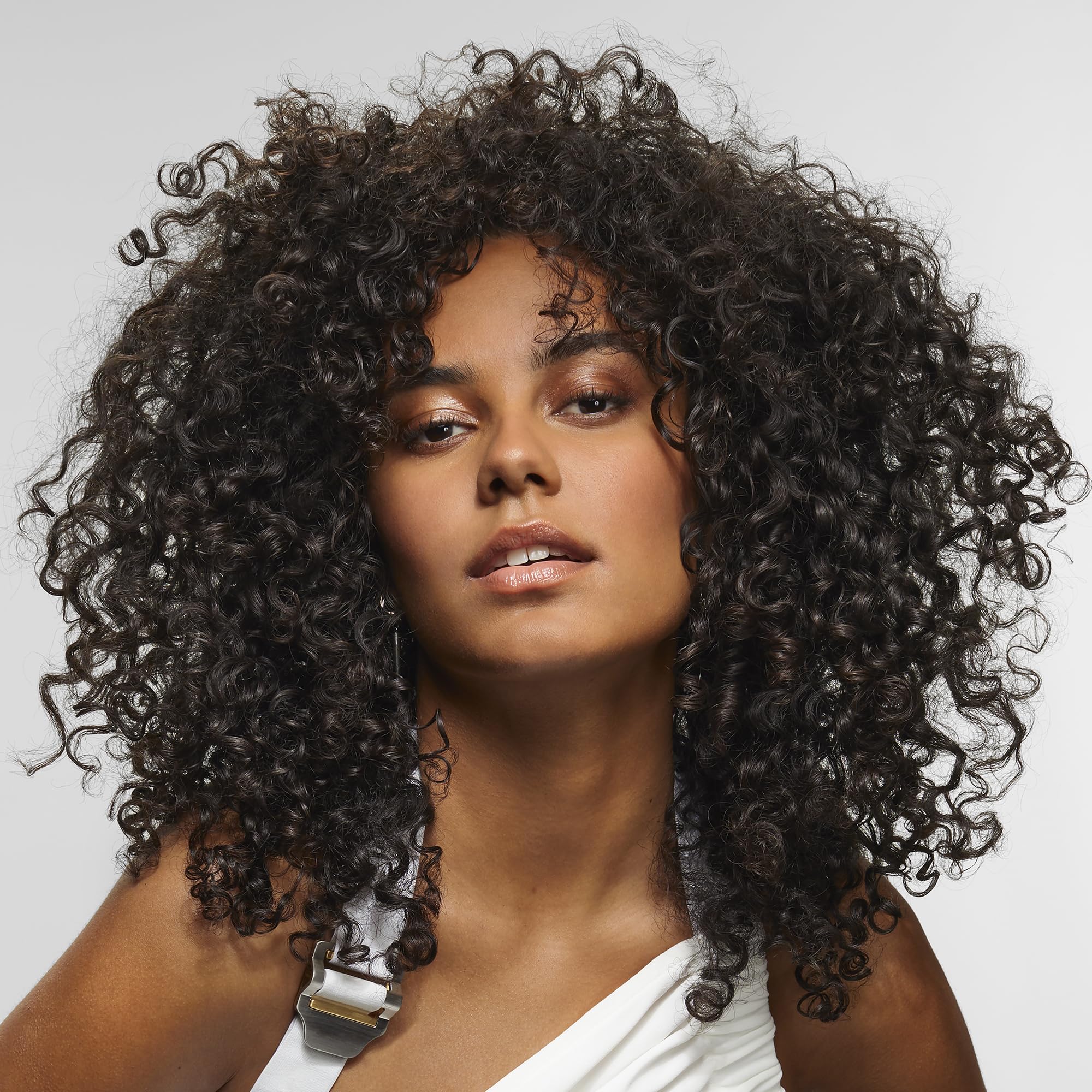 bumble and bumble before and after curls comparison illustrating improved definition and shine