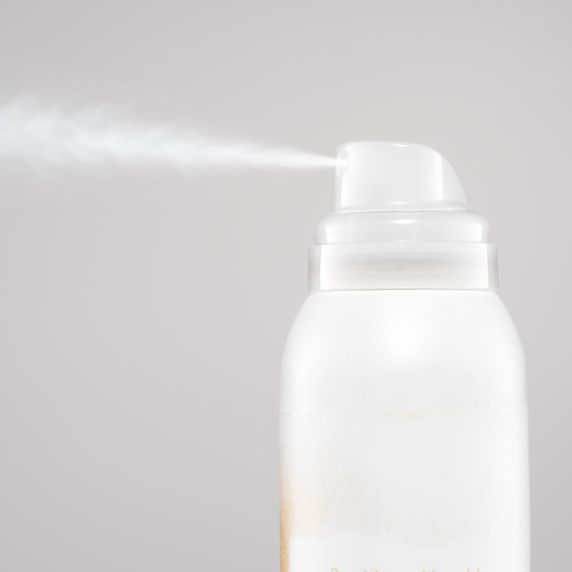 Bumble and bumble Blondish sprayed at roots demonstrating instant coverage and lift