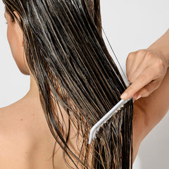 Bumble and bumble creamy texture close-up for smooth detangling benefit