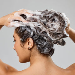 Bumble and bumble creamy shampoo texture closeup showing moisturizing lather