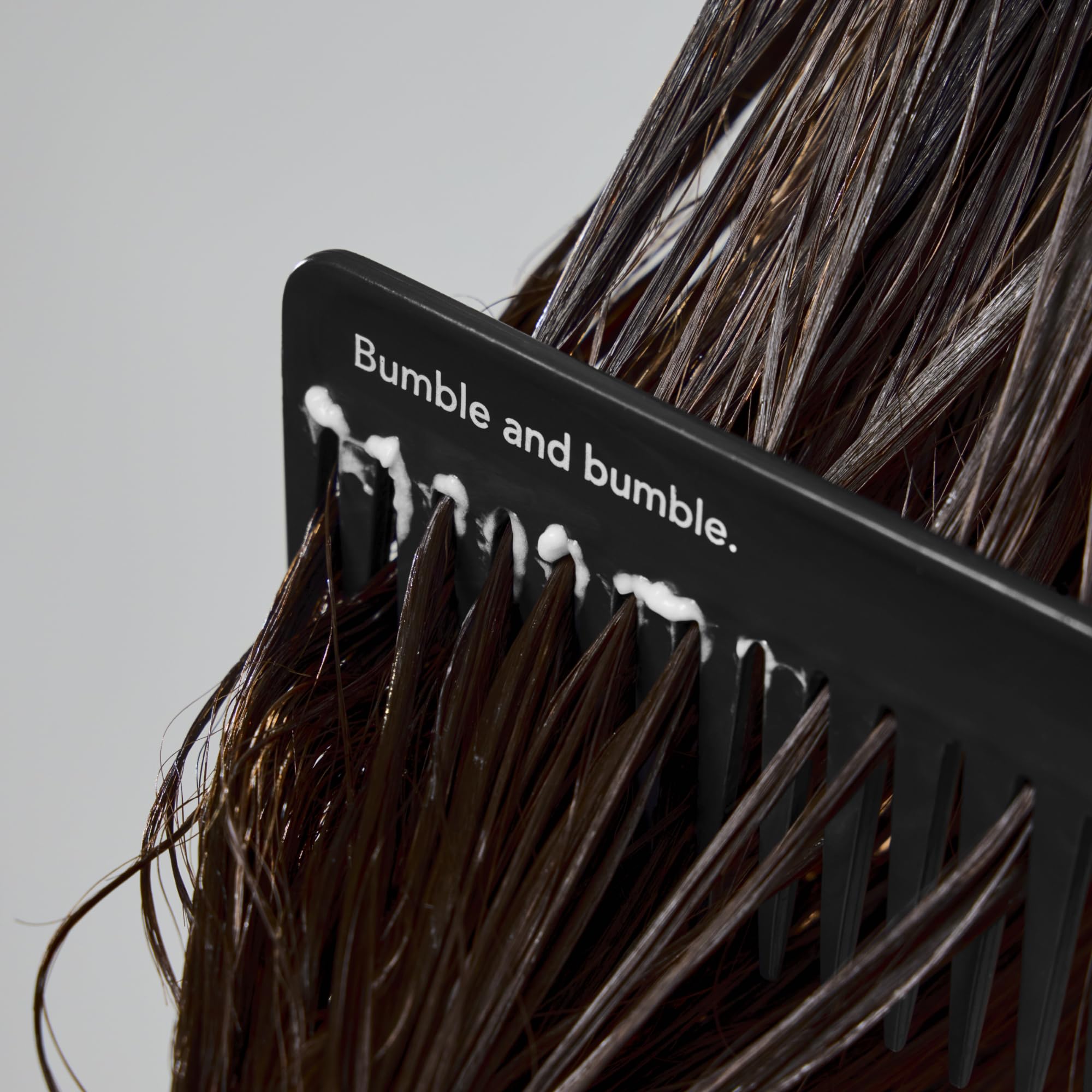 Bumble and bumble conditioner in bathroom setting suggesting daily luxury