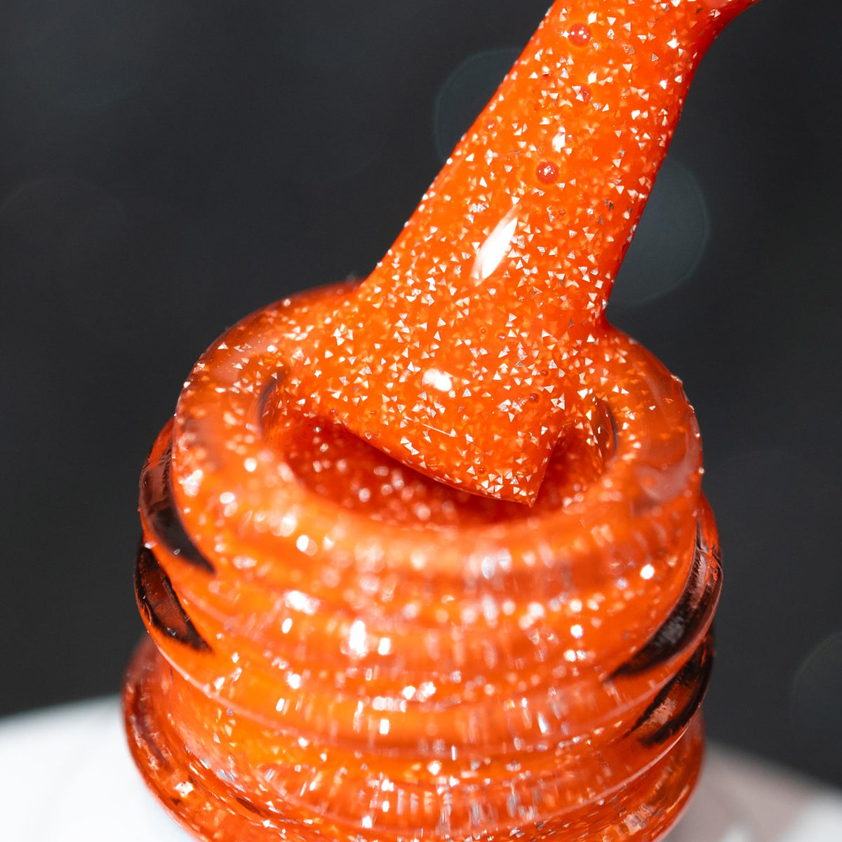 BURANO front bottle showing fall orange shade and glitter finish for vibrant nails